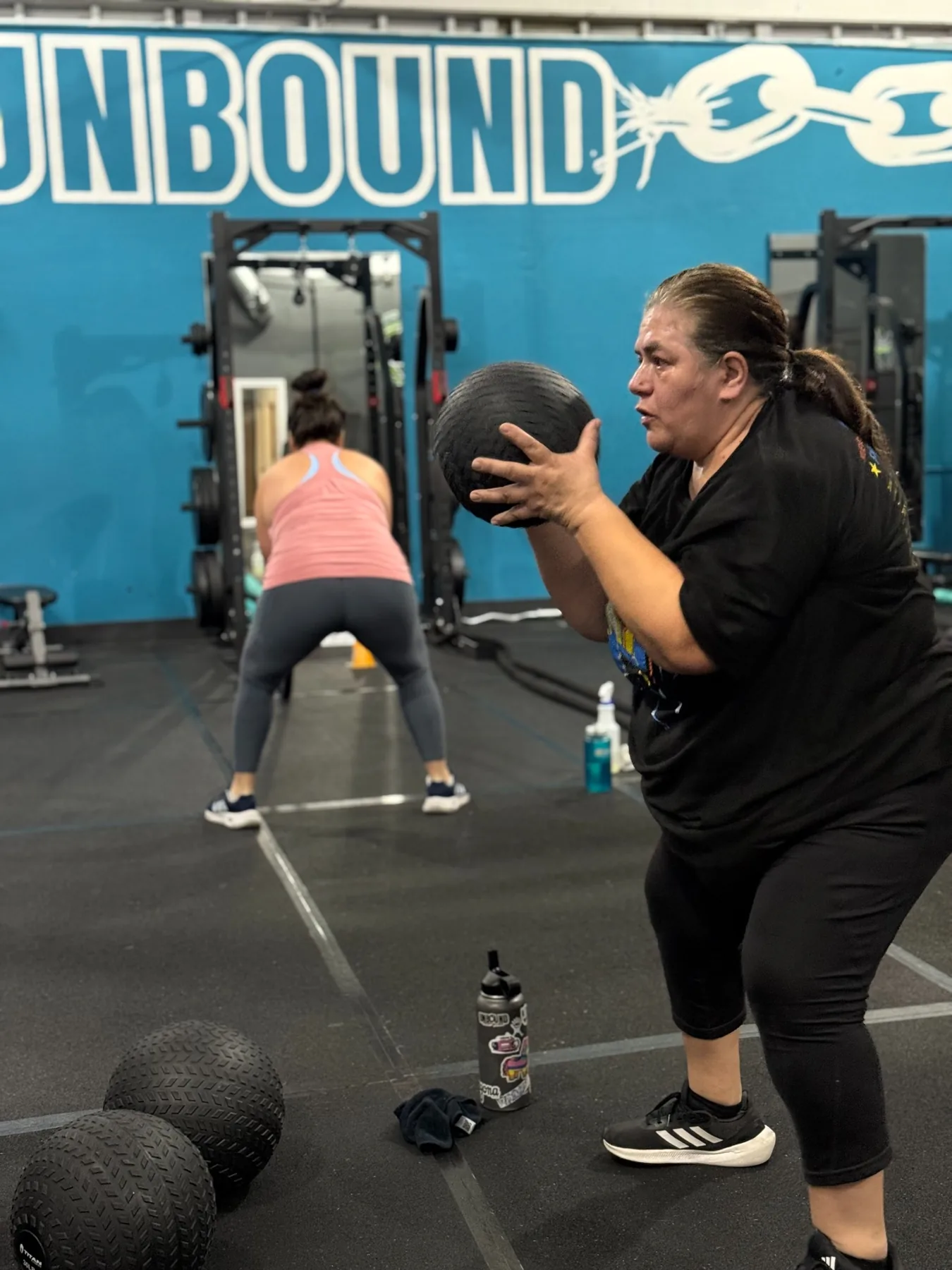 Alex coaching a client during a strength session